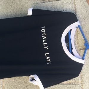 Black shirt with totally late in white